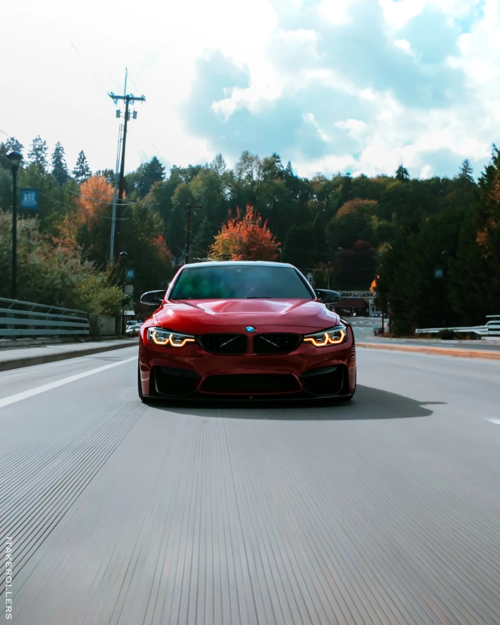 Red BMW M3 head-on rolling shot