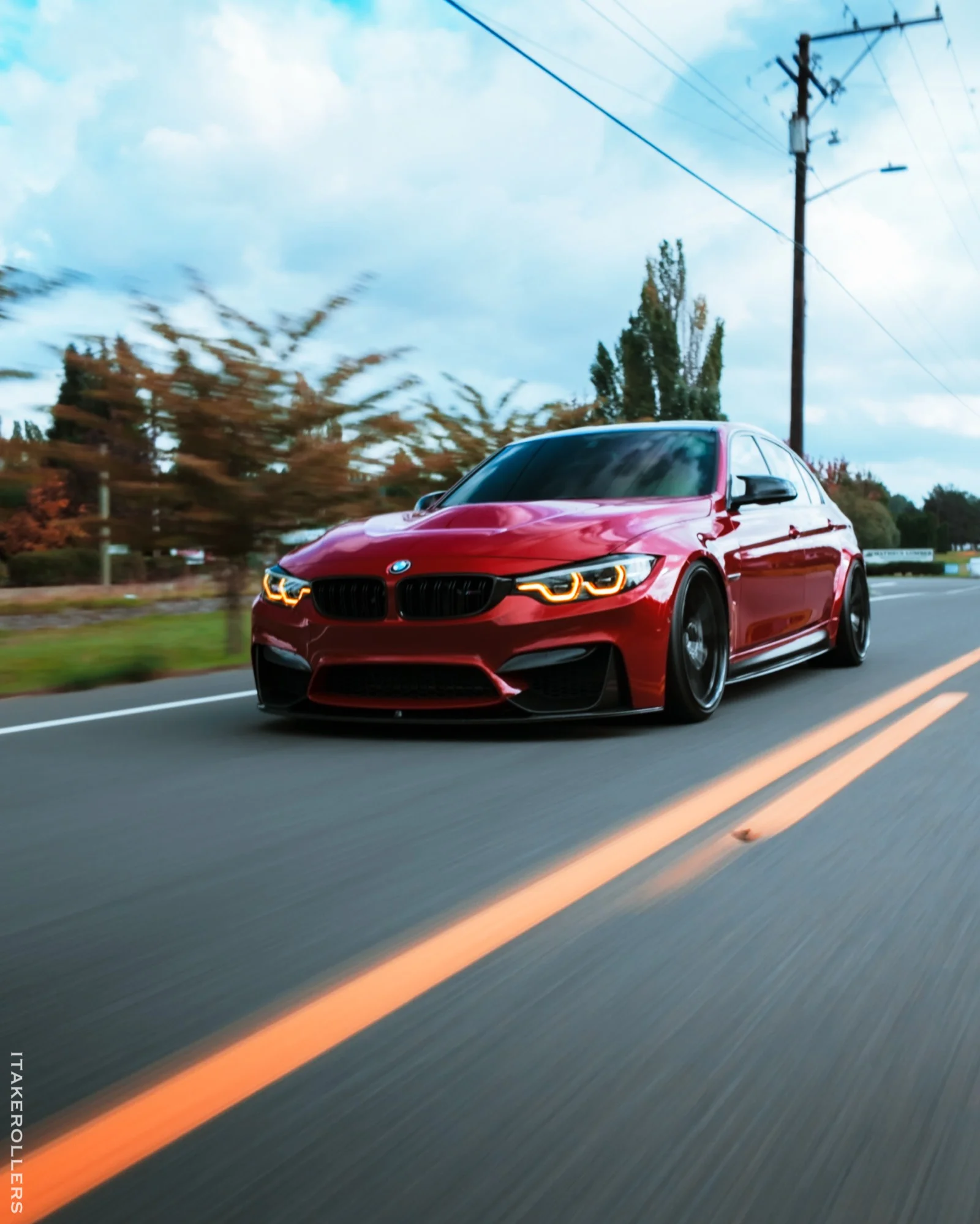 Red BMW M3 rolling shot