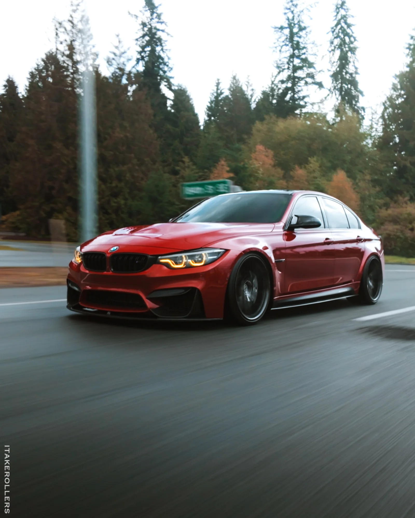 Red BMW M3 rolling PNW