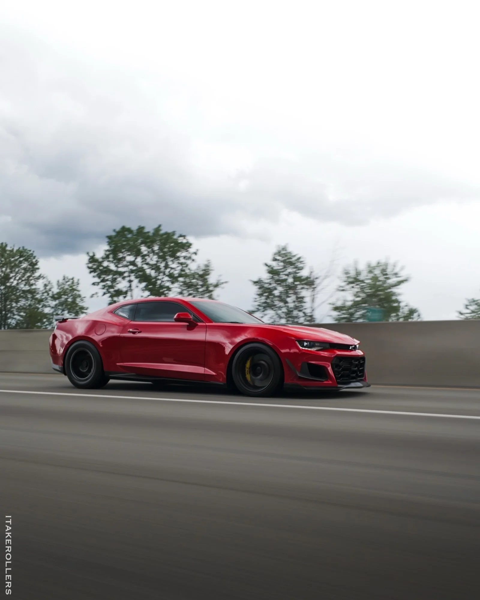 Red Camaro ZL1 highway rolling shot